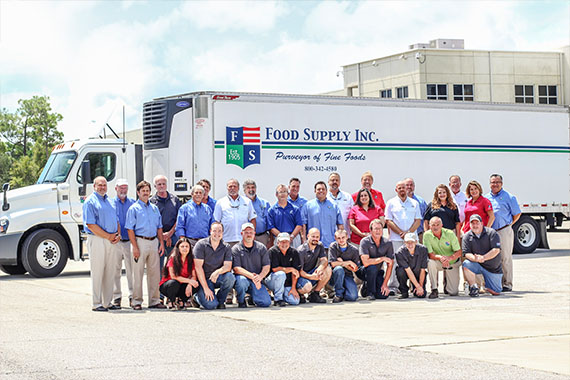 Male Carpenter And Coworker Carrying Lumbers At Construction Sit